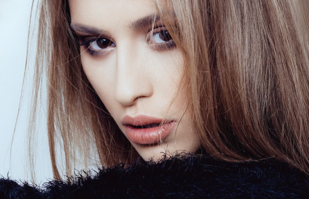 Do Lip Fillers Hurt? Here's What You Need To Know 3 Perfectly defined lips on a woman after aesthetic lip procedure.