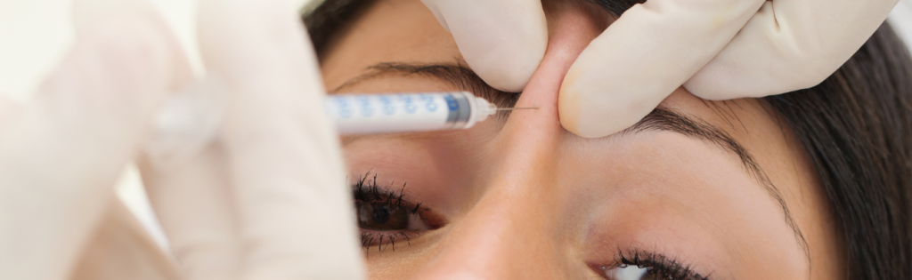 Unveiling the World of Botox: Duration, Costs, and More 2 Woman undergoing a Botox procedure performed by a qualified practitioner in a professional clinical setting.