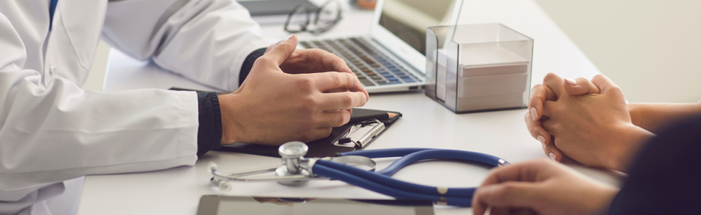 Aesthetic practitioner conducting an initial consultation with a new client.