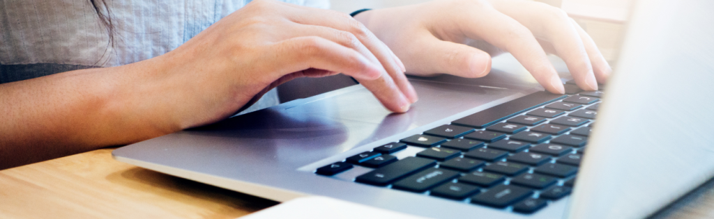 Marketing Strategies for Aesthetic Practices: Boosting Your Clinic's Visibility and Growth 1 Person typing on a laptop, representing building a strong online presence.