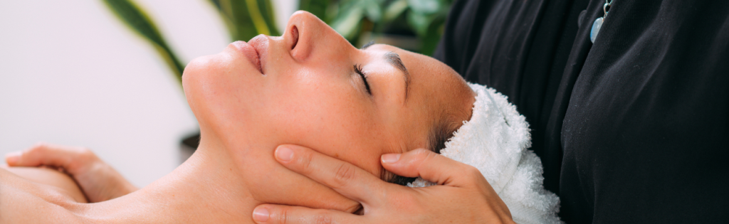 a woman getting facial massage