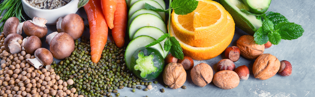 Healthy colourful vegetables displayed on a rustic kitchen surface.
