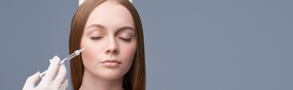 <strong>Delving into Dermal Fillers: How Safe Are They?</strong> 2 Aesthetic practitioner administering cheek filler for facial contouring.