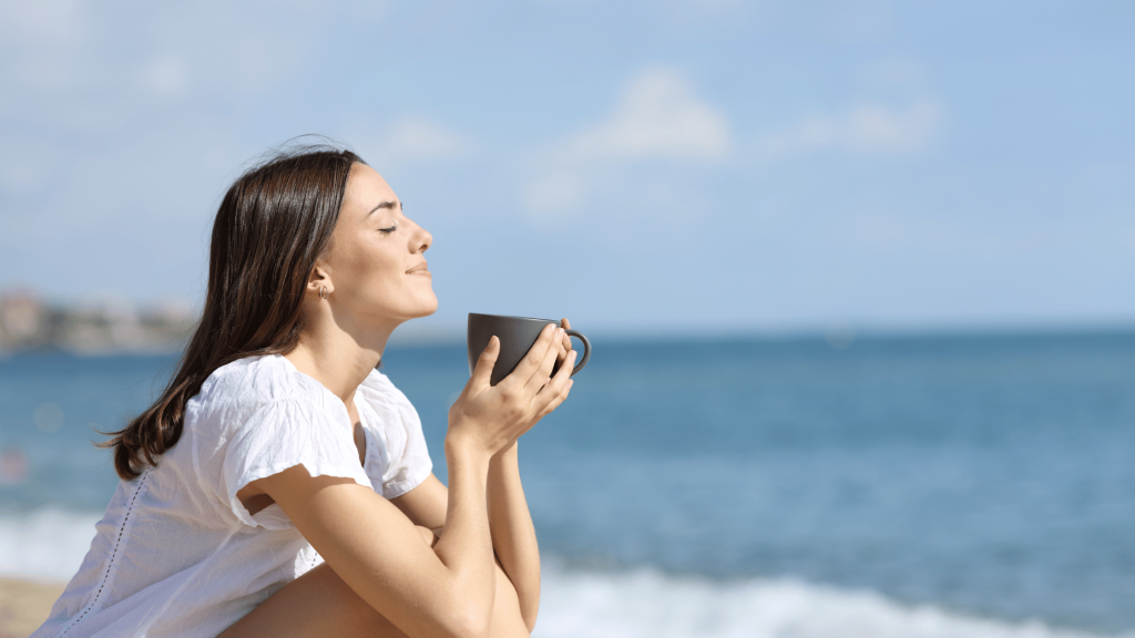 Faces | Unleash Your Summer Confidence 1 a woman enjoying a cup