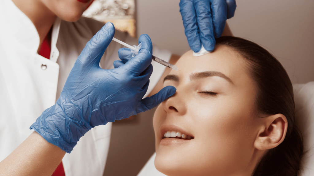 An In-Depth Guide to Budgeting for Aesthetic Treatments 1 Woman receiving Botox injections in a professional clinical setting.
