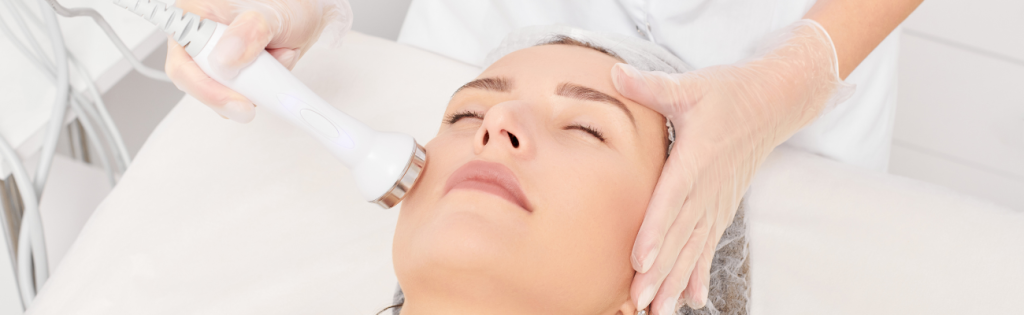 Faces | Future Trends in the Aesthetic Industry 2 Woman undergoing advanced aesthetic treatment in a professional clinic.