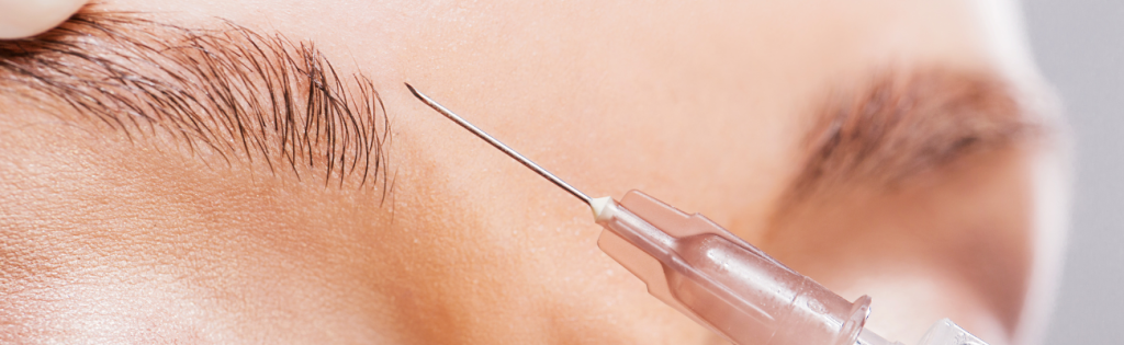 Faces | Botox Complications 2 Close-up of a woman receiving Botox injection from a qualified practitioner.