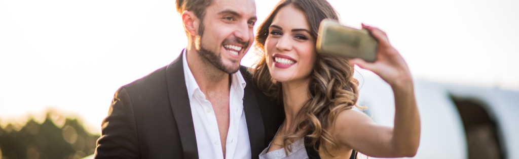 Celebrities using a phone to take a selfie.