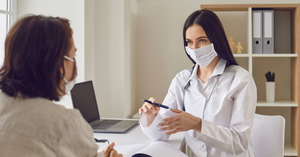 Making Buy Now Pay Later Ethical: Solving Client Impulsive Buying 2 Aesthetic practitioner explaining finance options to a client during a consultation in a clinic setting.