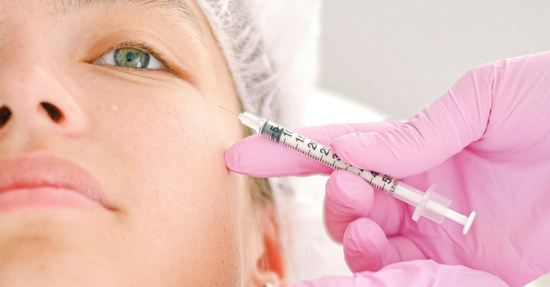 Client receiving Botox injections from a qualified aesthetic practitioner.
